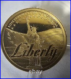 585 14k Yellow Gold Symbol of Freedom Coins 1g total weight of both (2)