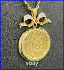 A 22k gold 2003 half Sovereign Coin with Diamond & Ruby in 9ct gold Pendant 9.28g