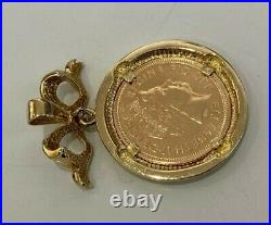 A 22k gold 2003 half Sovereign Coin with Diamond & Ruby in 9ct gold Pendant 9.28g