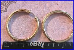 Roberto Coin Earrings Hammered Hoops 18k yg, large, one ruby gone