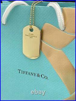 Tiffany & Co Coin Edge 18 kt Gold dog tag pendant On 24 Chain Necklace