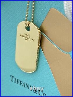 Tiffany & Co Coin Edge 18 kt Gold dog tag pendant On 24 Chain Necklace